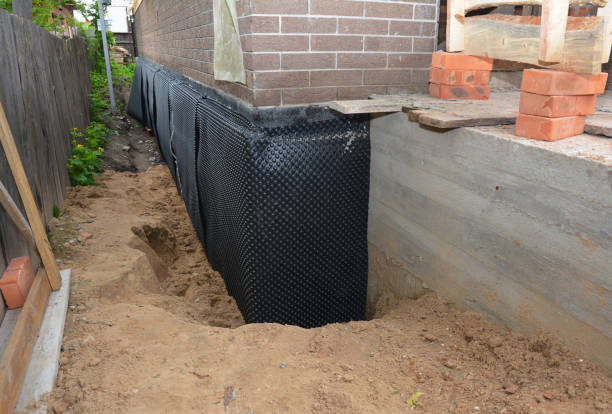 Happy homeowners after waterproofing job in Lake Orion